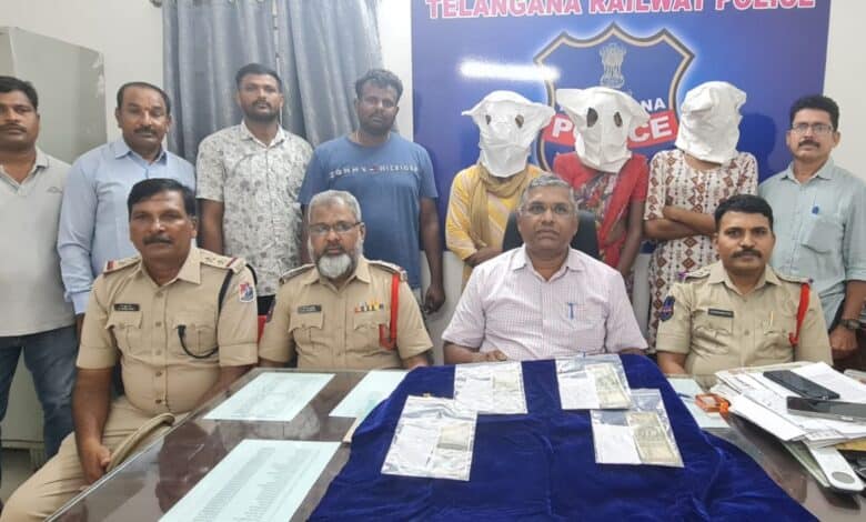 Police officials with the accused during a press briefing on the robbery pm train