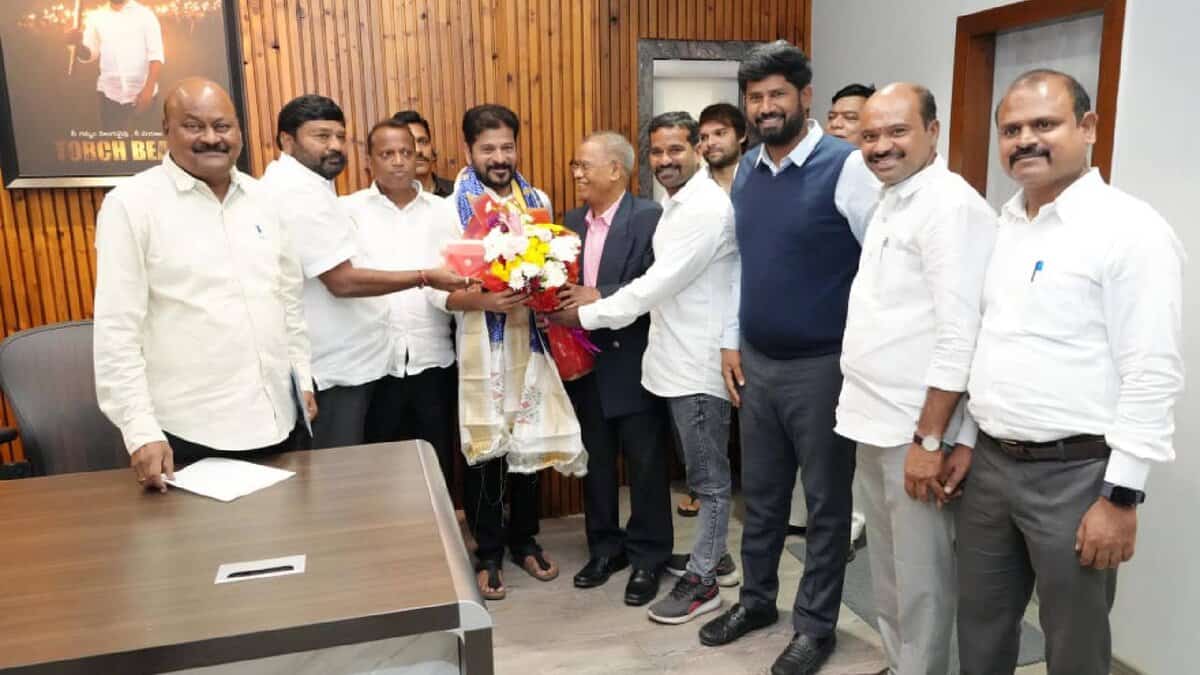 Members of the newly formed NRI Advisory Committee present a bouquet and shawl to Telangana Chief Minister A Revanth Reddy during a courtesy visit at his residence in Hyderabad on May 5.