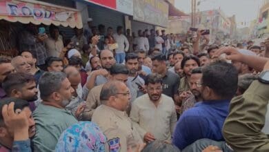 Protestors gaten in Bhavaninagar raising slogans against the local SHOs.