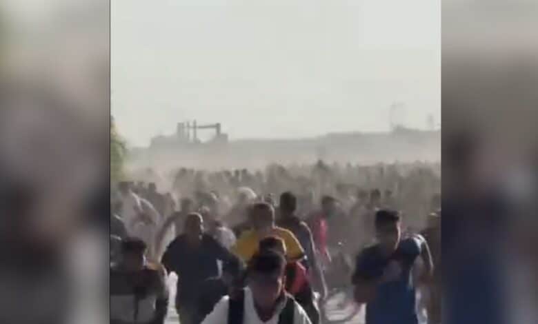 The image displays a picture of Palestinians running for their life as Israeli army opened fire in Gaza Strip
