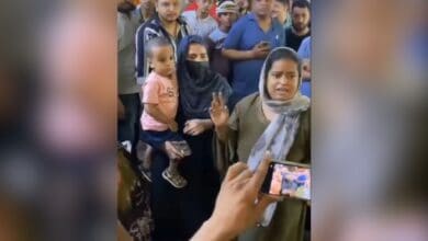 The image displays two Muslim women who were attacked for their religious identity in New Delhi