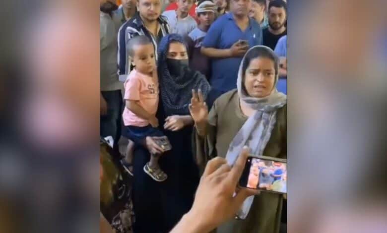 The image displays two Muslim women who were attacked for their religious identity in New Delhi