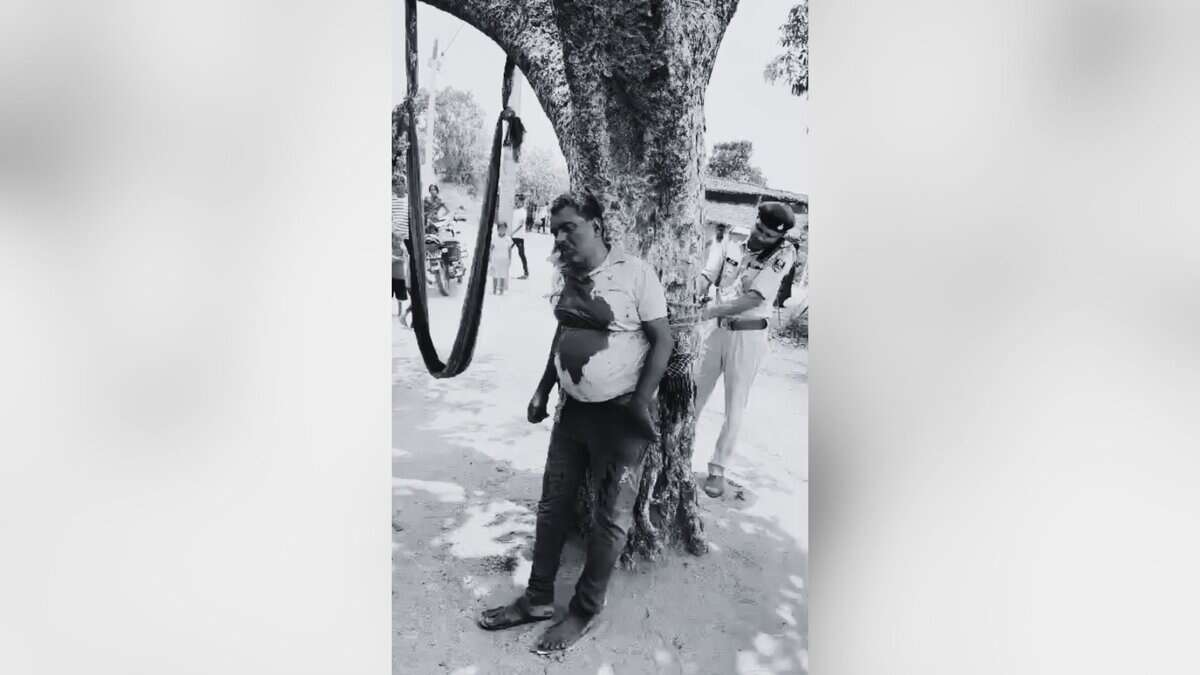 The image displays a black and white picture of a doctor who was assaulted in Bihar