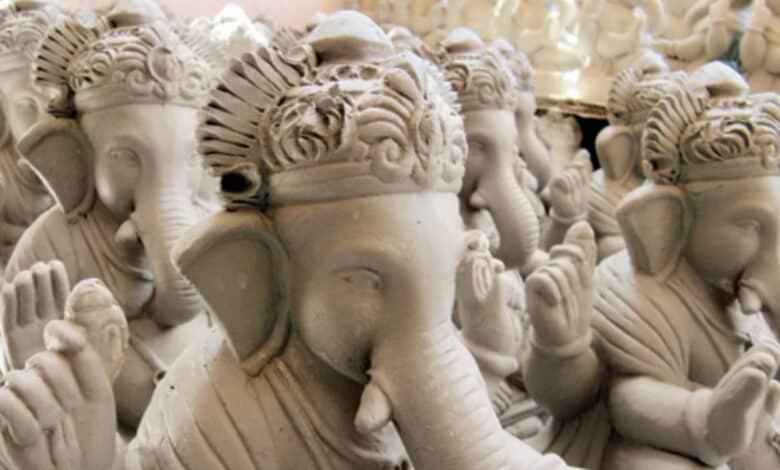 The image displays a picture of eco friendly Ganesh idols