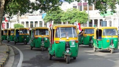 The image displays a picture of eco friendly autos in Hyderabad