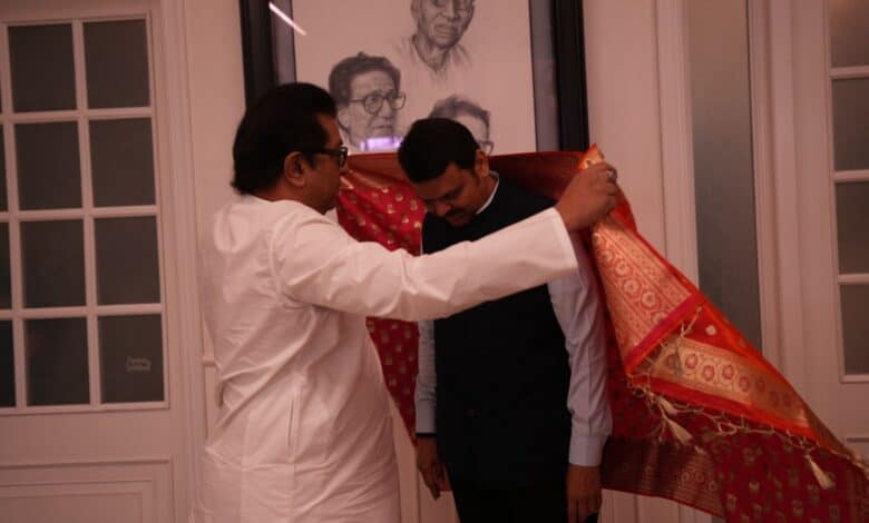 The image displays a file picture of Devendra Fadnavis and Raj Thackeray