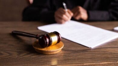 represental image showing gavel and papers for court case ruling