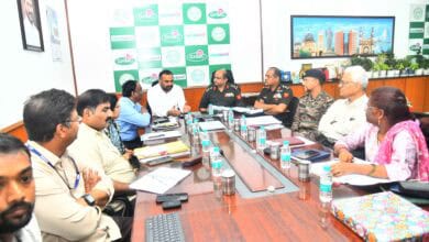 Image of GHMC officials with Defence officials discussing transfer of land.