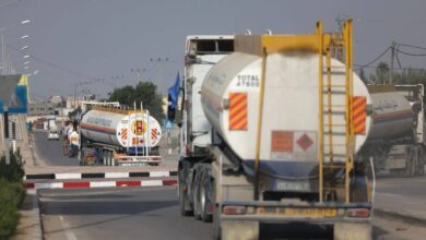 A convoy of fuel tankers drives through a street in Gaza, delivering much-needed fuel amid ongoing shortages. This marks the first UN-permitted fuel delivery into the territory in over 130 days, as humanitarian conditions remain dire.