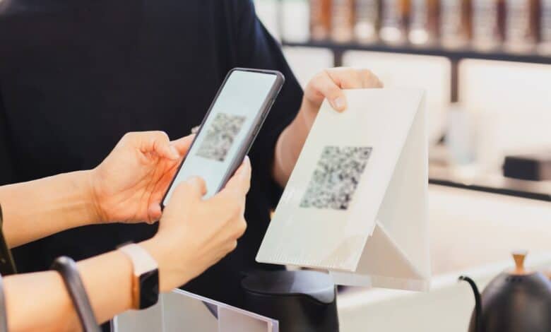 QR code being scanned by a person