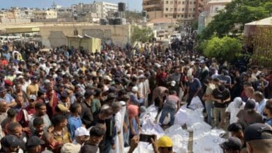 Relatives of Palestinians, who were killed in an Israeli attack on Khan Younis, attend a funeral ceremony in front of Nasser Hospital in Gaza City on Friday [Abdallah Fs Alattar/Anadolu]