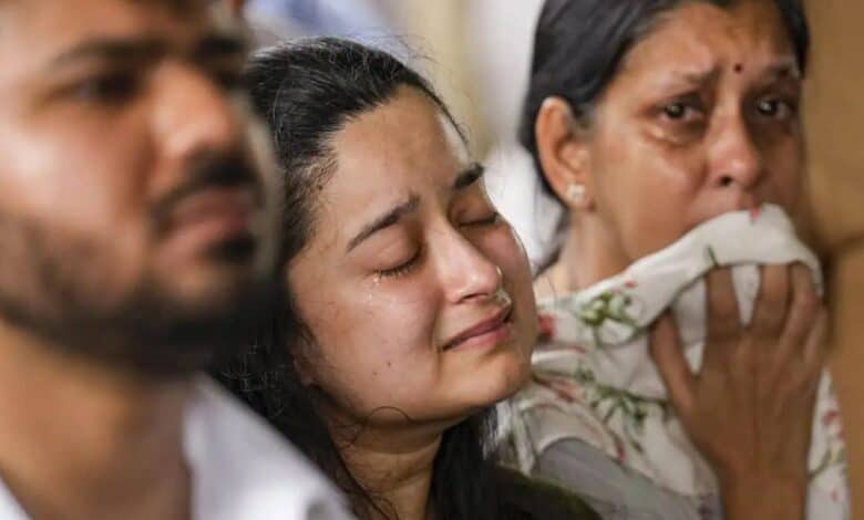 Bereaved family members of one of the passengers who perished in the ill fated London-bound Air India plane crash The flight, a Boeing 787 Dreamliner (AI 171) with 242 people on board, crashed into a medical hostel and its canteen complex in the Meghaninagar area, moments after taking off from the airport. (PTI)