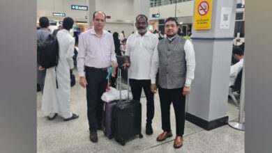 The image of a Augustin Dassayan (centre), the Indian survivor of a Red Sea ship attack, stands at a Saudi airport with Indian consulate staff before flying home.