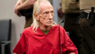 Joseph Czuba, an elderly white man with long white hair, appears in court wearing a red prison uniform.