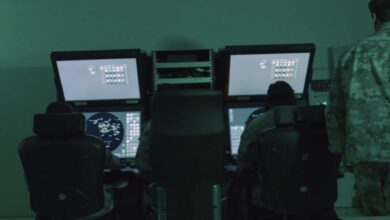 Qatari military personnel monitor radar and missile tracking systems inside an operations control room during Operation Breaking the Spears.