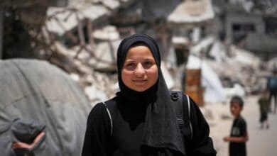 Sarah Qanan, 18, stands for a photo in Khan Younis, Gaza, on June 28, 2025, highlighting Gaza’s education crisis amid war.