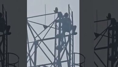 man clims cell tower in Mahabubabad