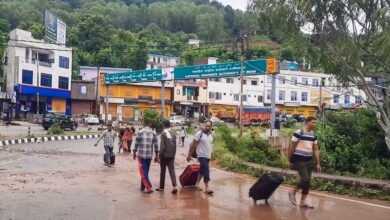 Udhampur: People with their luggage as two bridges on the Jammu-Srinagar National Highway damaged due to heavy rainfall, in Udhampur, Wednesday, Aug. 27, 2025. (PTI Photo)