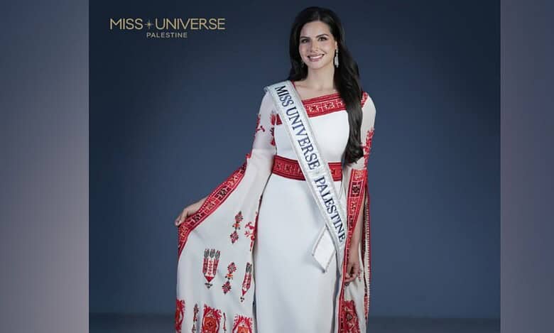 Nadeen Ayoub wearing a traditional Palestinian embroidered dress with the Miss Universe Palestine sash.