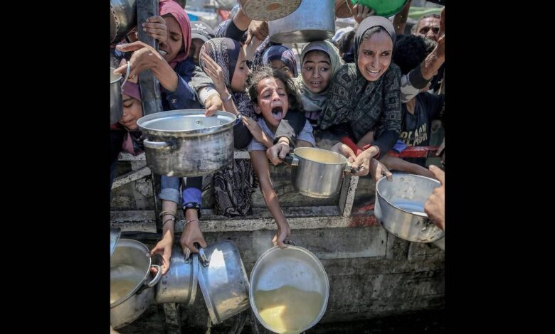 People wait for food aid in Gaza