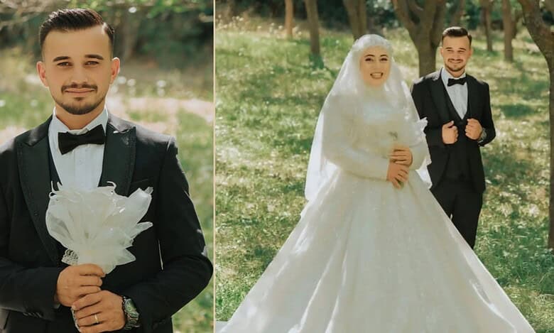 Elegant groom in black tuxedo holding a white bouquet outdoors.