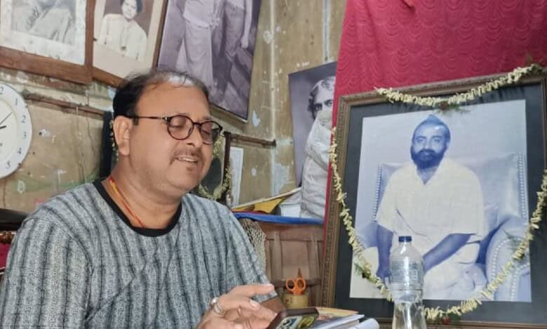 Shantanu Mukherjee with the portrait of his grandfather, Gopal Patha