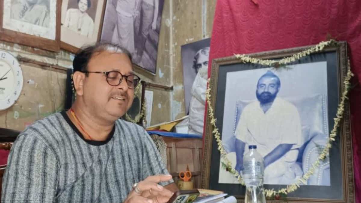Shantanu Mukherjee with the portrait of his grandfather, Gopal Patha