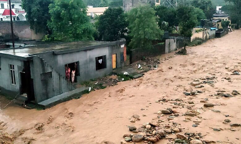 Debris and mud accumulated in a residential area following a cloudburst, in Kathua on Sunday (PTI)