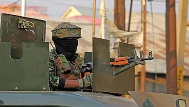 An Indian Army soldier guards a checkpost in Jammu and Kashmir