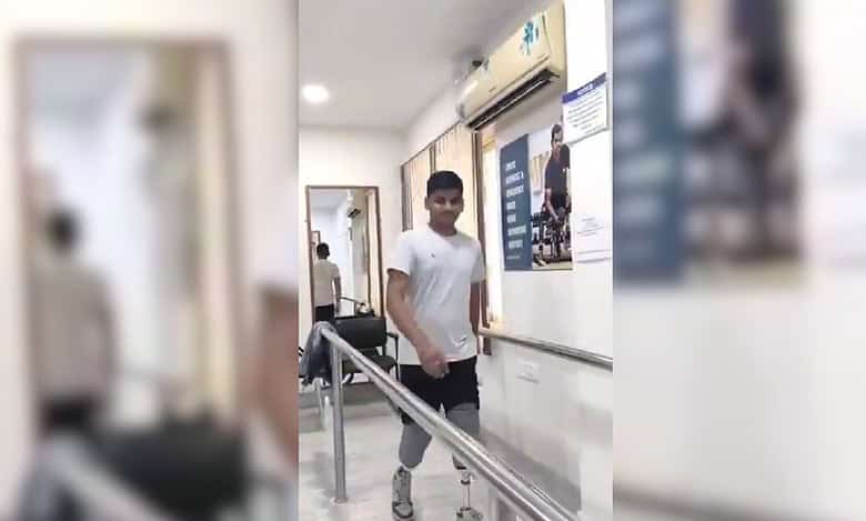 Telangana man who lost his legs walks again using prosthetic legs.