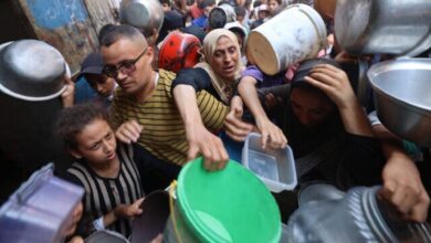 Palestinian families struggle to receive food aid at a crowded distribution point in Nuseirat refugee camp, central Gaza Strip, amid deepening famine.