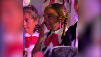 The image of tearful Palestinian children in school uniforms at a graduation ceremony in Gaza.