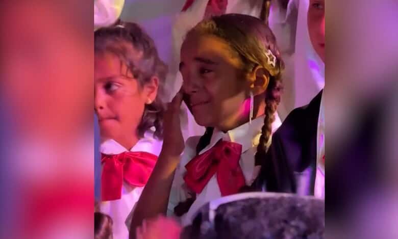 The image of tearful Palestinian children in school uniforms at a graduation ceremony in Gaza.