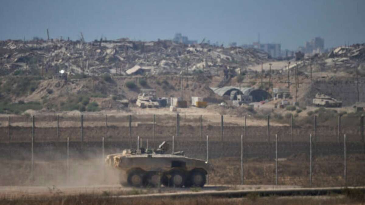 Israeli armoured vehicle patrols near Gaza border in southern Israel.