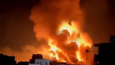 Flames and smoke rise during overnight bombing in Jabalia, northern Gaza.