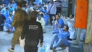 men in military garb killing medical worker