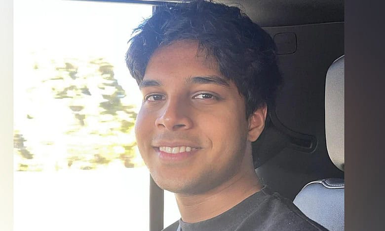 Image of Wayne Nash D’Souza, an 18-year-old Indian expat student and Dubai Duty-Free million-dollar draw winner, smiling inside a car.