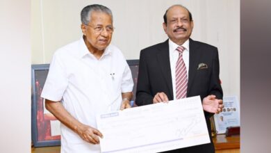 M A Yusuff Ali hands over Rs 10 crore cheque to Kerala CM for Wayanad rehabilitation.
