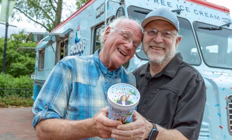 Ben Cohen (left) and Jerry Greenfield (right), co-founders of Ben & Jerry’s, hand out free ice cream