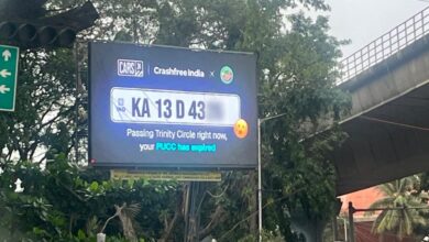 Billboard in Bengaluru displays traffic challans of cars passing by,