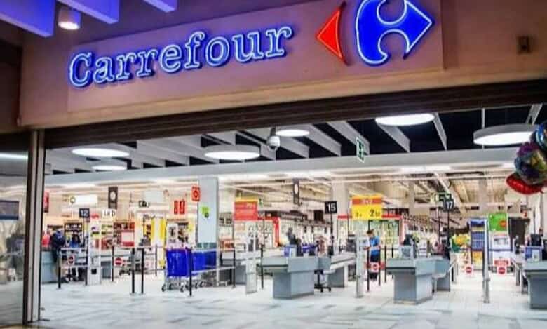 Carrefour supermarket entrance with checkout counters.
