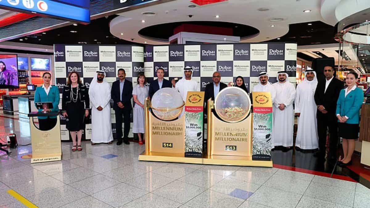 Dubai Duty Free officials and participants pose during the Millennium Millionaire draw at Dubai International Airport.
