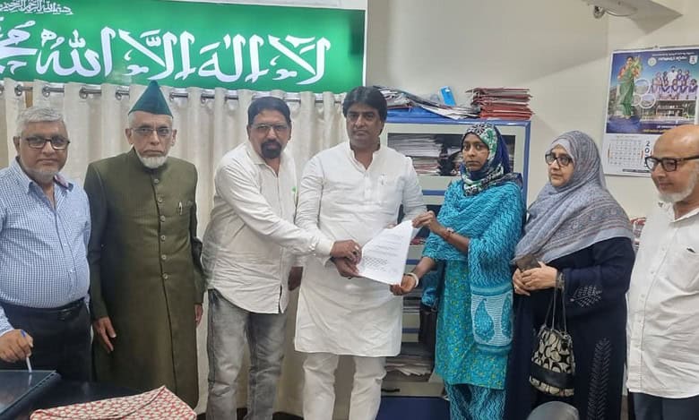 The image shows Congress leaders submitting the 2018 CWC report to Azmatullah Hussaini at Telangana Waqf Board office on Wednesday, September 24, 2025.