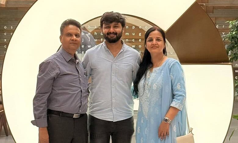 Software Engineer with his parents at the Google office in Ananta