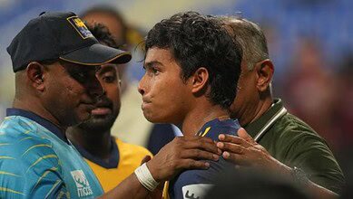 SL head coach Sanath Jayasuriya consoles Dunith Wellalage after the news of his father's passing during the Asia Cup.(XNewswire.lk)