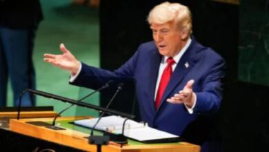 US President Donald Trump gestures while speaking at the United Nations General Assembly podium.