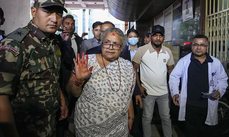 Nepal's interim Prime Minister Sushila Karki, center, arrives to meet the victims of the anti-government protests at a trauma center in Kathmandu, Nepal on Saturday. (PTI Photo/Arun Sharma)