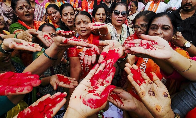 Shiv Sena (UBT) workers show their sindoor-smeared hands during a protest against the India-Pakistan Asia Cup cricket match in Navi Mumbai on Sunday. (PTI Photo)