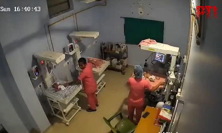 Nurses protect newborns from tremors after an earthquake of 5.6 Richter scale shook Assam on Sunday