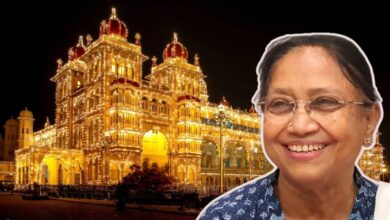 Luxurious illuminated building at night with smiling woman in foreground, featured in The Siasat Daily news.